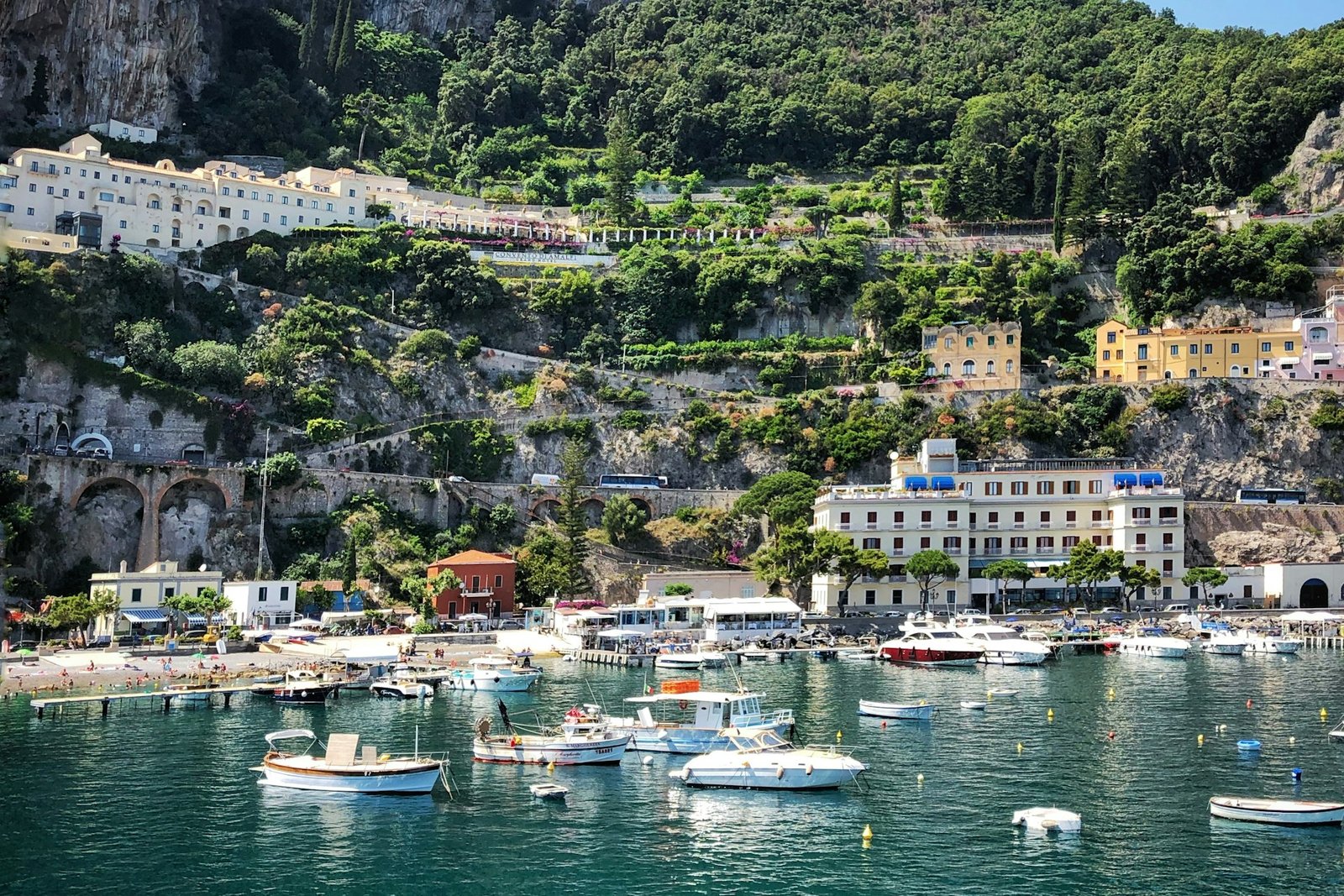 Boats floating on clear blue water along the Italian coast Boats floating on clear blue water along the Italian coast
