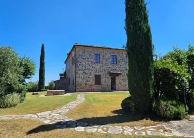 Stone villa with lawn, stone paths, olive trees and cypresses in Torrita di Siena